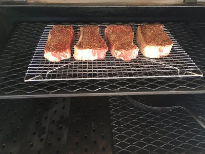 cheap steaks on for reverse sear.JPG